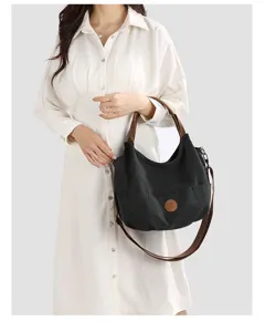 Casual canvas shoulder bag for women, large capacity tote bag with brown straps and top handle.