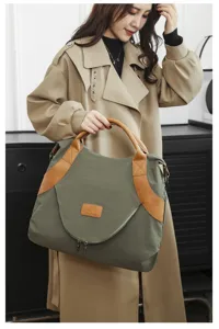 Detailed view of the large capacity nylon tote bag with leather details, perfect for daily use.