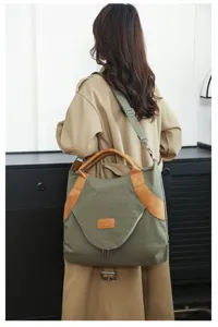 Vintage large canvas shoulder bag with brown leather trim, casual crossbody tote for women.