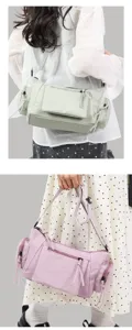 Detail view of the vintage multi-pocket shoulder bag with zippers and side compartments.