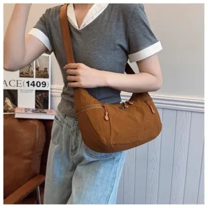 Casual brown nylon crossbody bag for women, stylish lightweight dumpling shoulder bag.