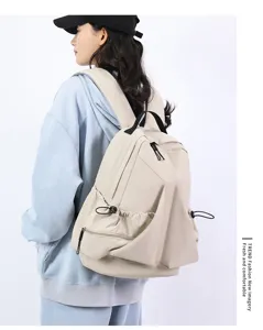 Casual pleated nylon canvas backpack with large capacity for daily use and school storage.
