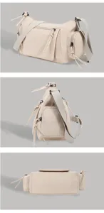 Close-up details of stylish women beige multi-pocket retro motorcycle shoulder crossbody bag