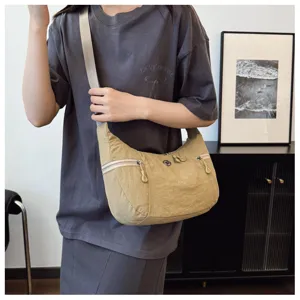 Casual nylon crossbody shoulder bag detail showing onbody style and practical capacity.