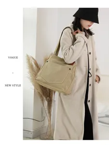 Sac à bandoulière en toile minimaliste de grande capacité pour femme avec poche avant.