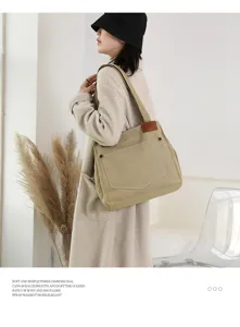 Sac à bandoulière en toile minimaliste de grande capacité, fourre-tout élégant.