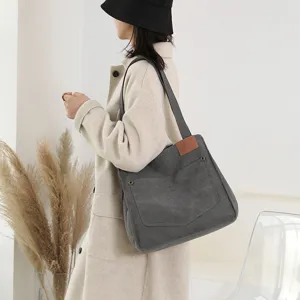 Sac bandoulière en toile grande capacité pour femme, fourre-tout élégant et pratique.
