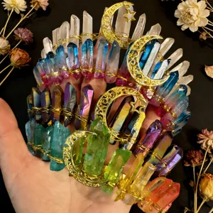 Detail view of handmade crystal tiara with colorful raw quartz and golden moon charms.