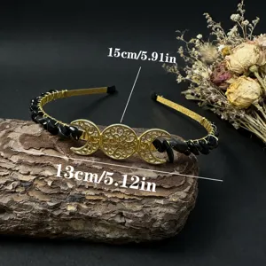 Detail view of the handmade triple moon crystal headband with black stones and gold wire.