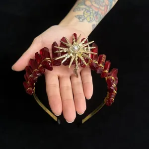 Red crystal crown headband with gold sun goddess accessory, bohemian hair hoop for women detail.