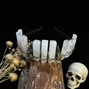 Detailed view of gothic crystal headband with natural quartz columns and vintage bird skull charms.