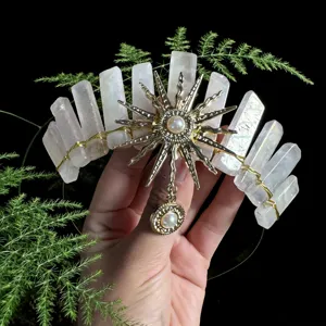 Detail view of the crystal crown headband featuring sun goddess motif and raw crystal pillars.