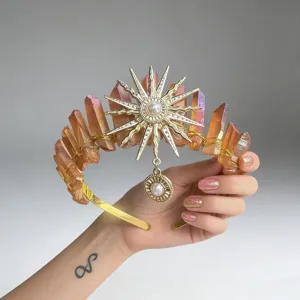 Crystal crown headband detail view featuring sun goddess pendant and raw quartz crystal points.
