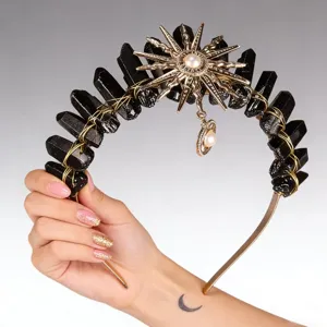 Close-up detail of the black crystal sun tiara showing intricate wire wrapping and pearl.