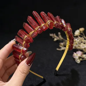 Detailed view of handmade red quartz crystal crown headband with gold wire wrapping design.