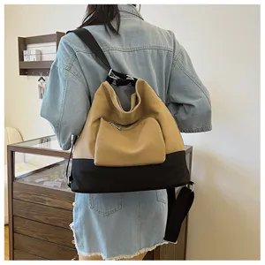 Stylish contrast color canvas backpack for women, versatile shoulder bag with spacious design.