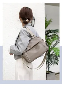 Close-up view of the multi-layer casual nylon crossbody shoulder bag, showing texture and strap.