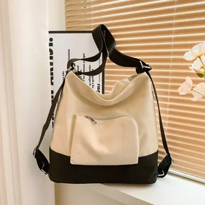 Stylish canvas shoulder bag for women, versatile multi-use crossbody and casual backpack.