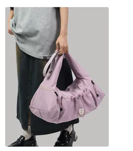 Large capacity casual shoulder bag in light purple with drawstring design for daily commute.