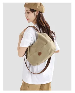 Stylish canvas shoulder bag for women, large capacity commuter tote and casual handbag.