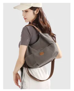 Stylish canvas shoulder bag for women, large capacity casual commuting tote handbag.