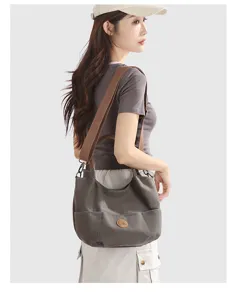 Casual canvas shoulder bag for women, stylish large capacity daily tote and commute handbag.
