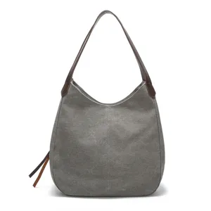 Casual grey canvas shoulder bag for women, stylish hobo handbag with brown leather straps.