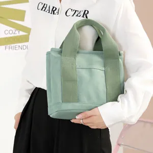Casual green canvas tote bag for women, large capacity handbag with top handles and pocket.