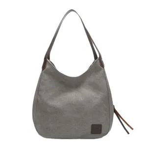 Casual canvas shoulder bag for women, stylish hobo tote with leather straps for daily use.