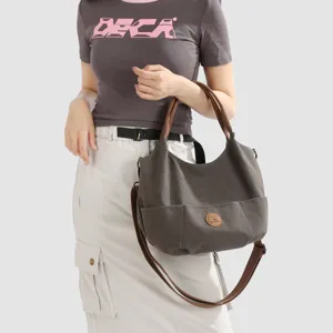 Canvas shoulder bag for women, large capacity casual tote bag, stylish underarm commuting bag.