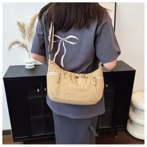 Detail view of a lightweight nylon crossbody hobo bag in khaki, perfect for casual daily wear.