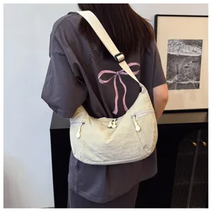 Beige lightweight nylon crossbody bag, casual single shoulder daily handbag for street travel.