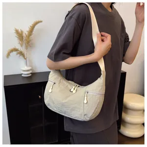 Casual nylon shoulder bag for women, lightweight crescent crossbody bag with multiple zipper pockets.