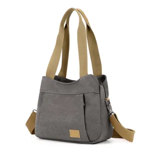 Casual canvas shoulder bag for women, large capacity tote handbag with stylish cross body strap.