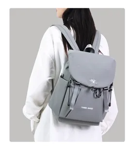 Stylish casual grey backpack with large capacity, perfect for daily commuting and school use.