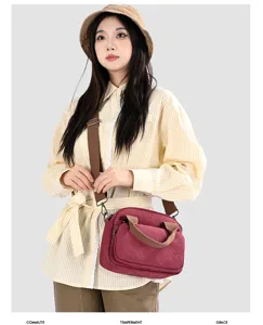 Canvas crossbody bag for women, casual retro shoulder bag with multiple pockets and strap.