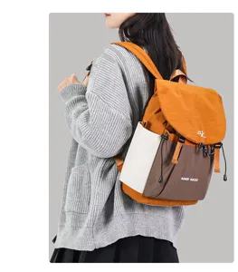 Stylish colorblock casual backpack for students, large capacity daily travel school bag.