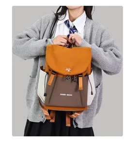 Korean style color-blocked backpack with large capacity, casual canvas school bag for daily travel.