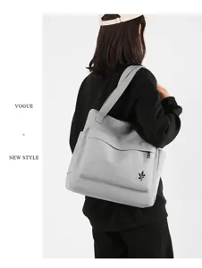 Minimalist large capacity canvas shoulder bag for women, stylish casual daily tote handbag.