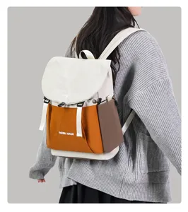 Casual color-block backpack for daily student use, large capacity travel rucksack, stylish.