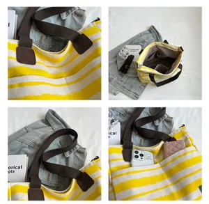 Gedetailleerd overzicht van geel-witte gestreepte canvas tote bag met bruine banden en handige vakken.