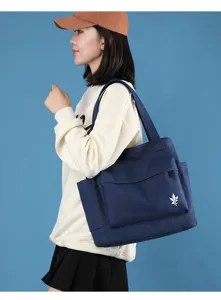 Casual dark blue canvas shoulder bag for women, large capacity minimalist tote design.