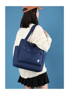 Casual blue canvas tote bag for women, large capacity stylish shoulder handbag for daily use.