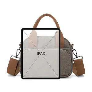 Casual canvas shoulder bag for women, stylish contrast color handbag with top handle and strap.