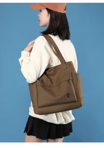 Casual canvas tote bag for women, large capacity daily shoulder bag with stylish design.