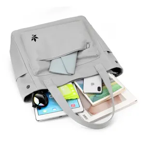 Stylish casual canvas tote bag for women, large capacity shoulder handbag with front pocket.