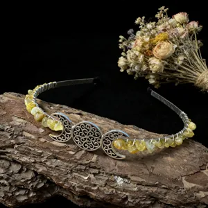Handmade crystal chip moon crown headband, delicate metal wire wrapped hair accessory detail.