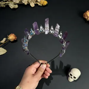 Detailed view of the gothic amethyst crystal crown headband with silver skull charms.