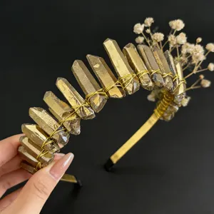 Detailed view of handmade crystal crown headband with gold wire and dried flowers for women.