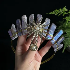 Close-up detail showing the natural crystal crown headband with a radiant sun goddess pendant.